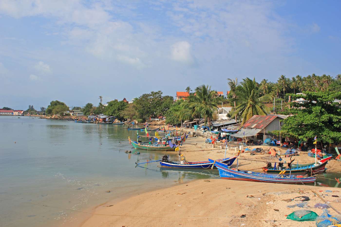 Bophut, Koh Samui, Thailand - March 16, 2014:Colorful view to village in the morning. Longtail boats are waiting fishermen near Big Buddha Statue.