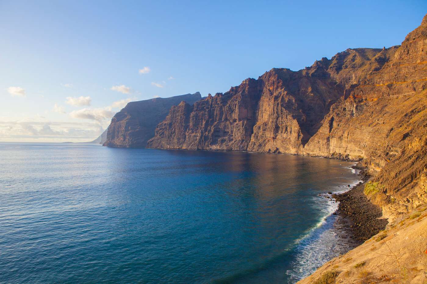 Acantilados de los Gigantes, giant's cliffs in Tenerife Island. South western part of the island with amazing basalt walls that ends in the ocean. Sunny afternoon with calm waters.