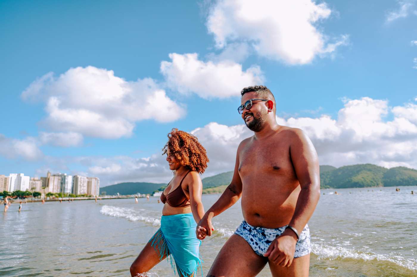 Couple leaving the sea in summer