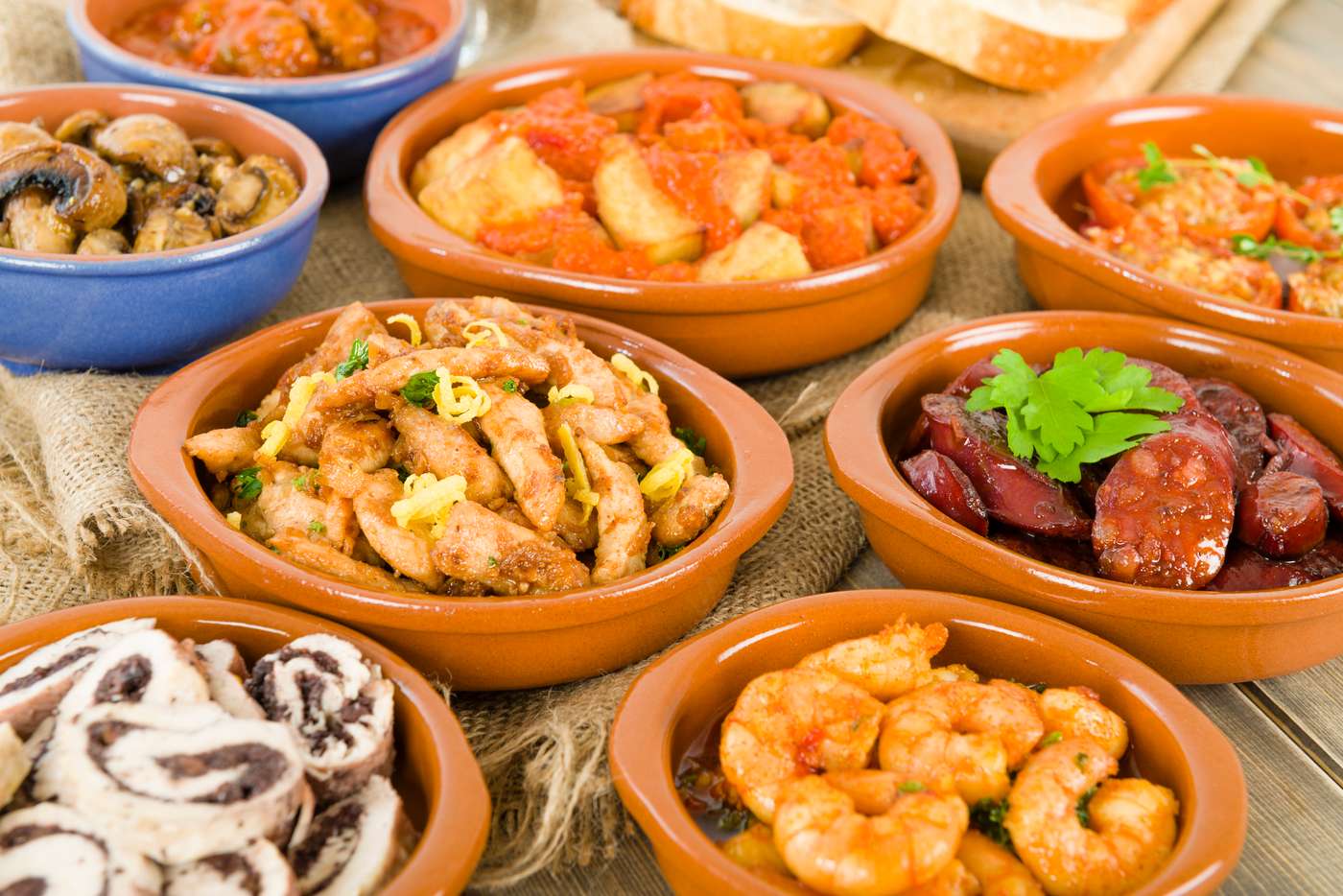 Chorizo al vino, prawns pil pil, patatas bravas, albondigas a la jardinera, mushrooms with garlic, chicken with lemon with garlic, chicken rolls with olives, tomatoes with garlic