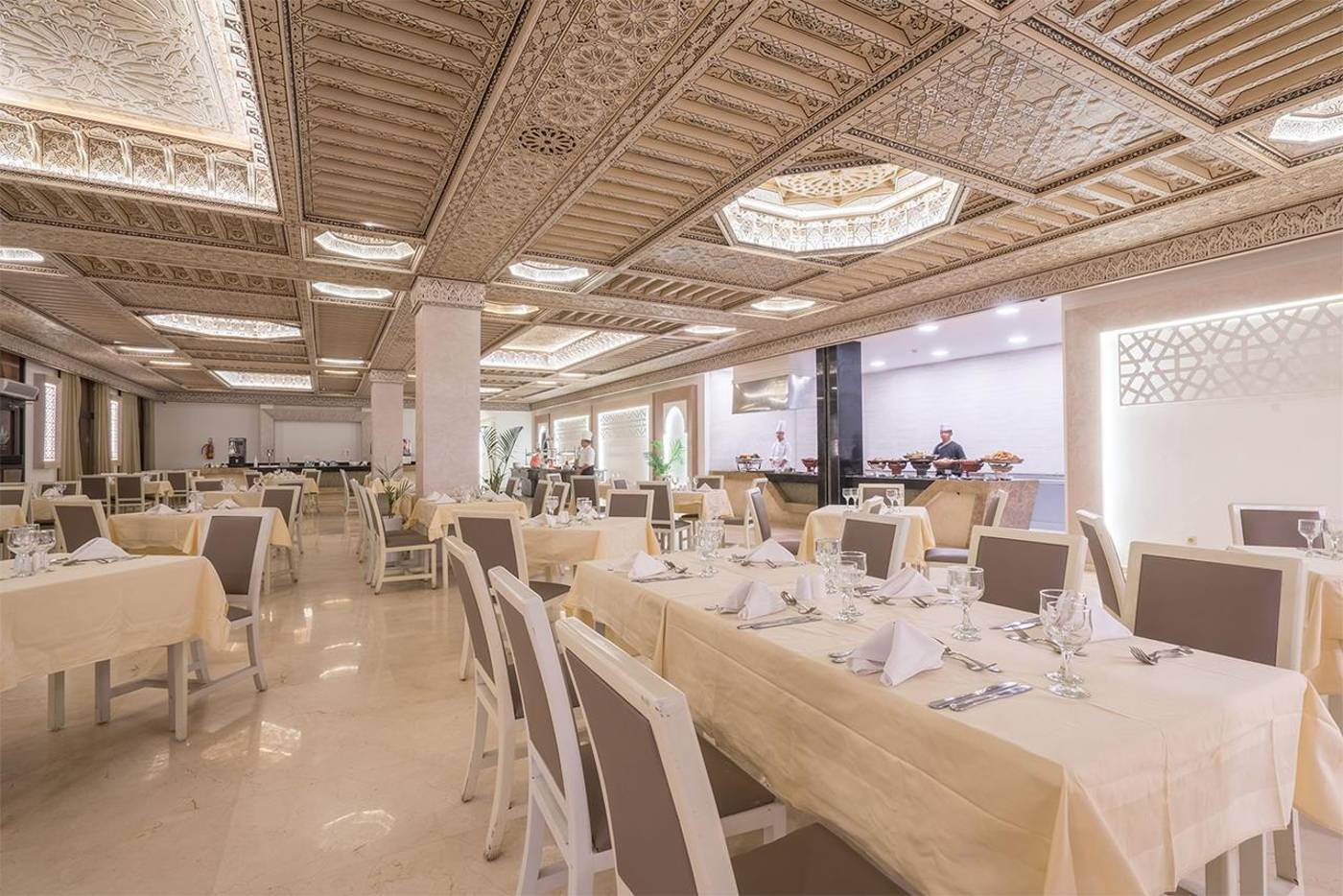 Internal restaurant seating area with lovely decor and table settings at the Aqua Fun Club. 