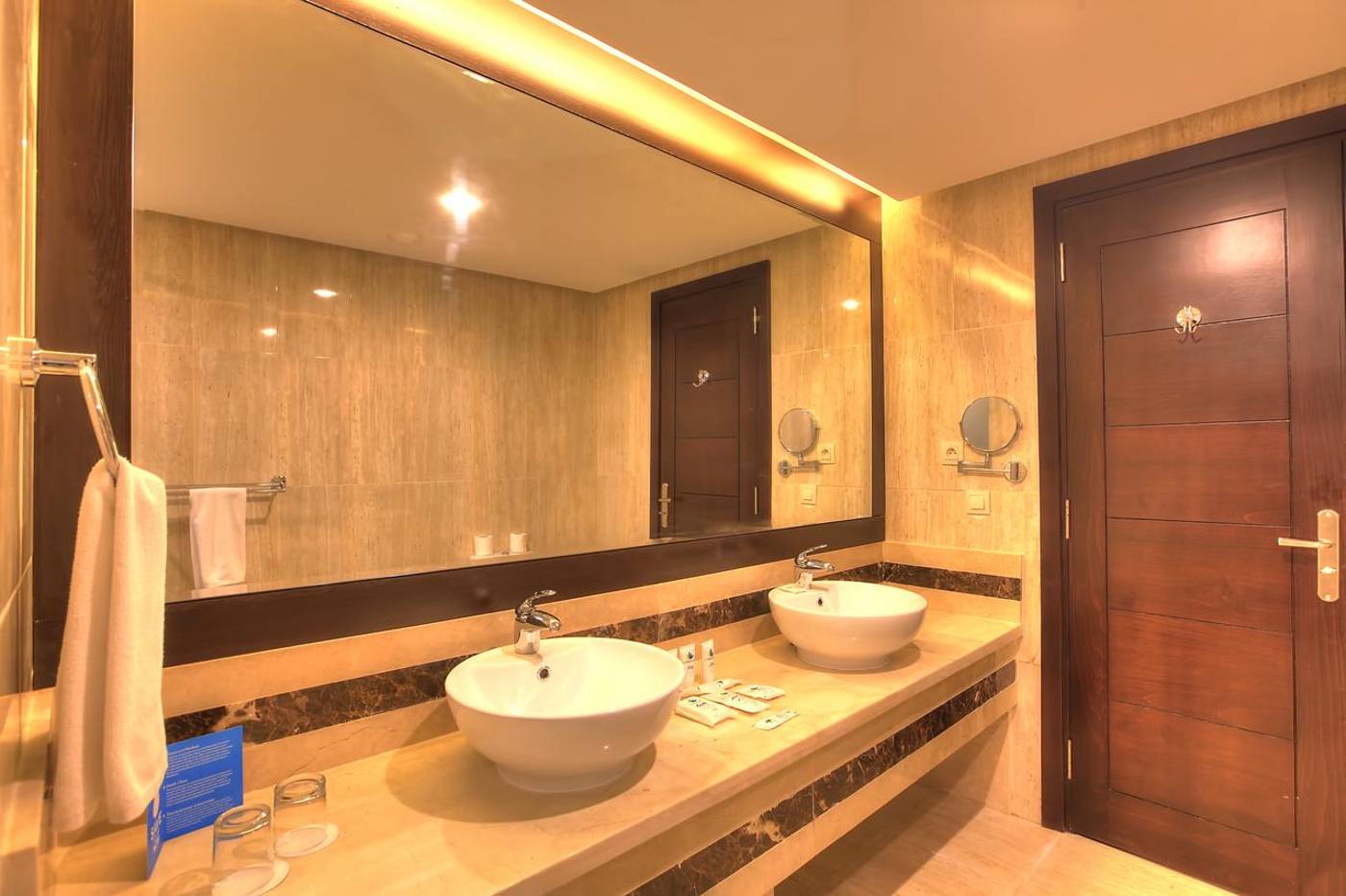 Double sink and large mirror in one of the room options bathrooms at the Aqua Fun Club. 