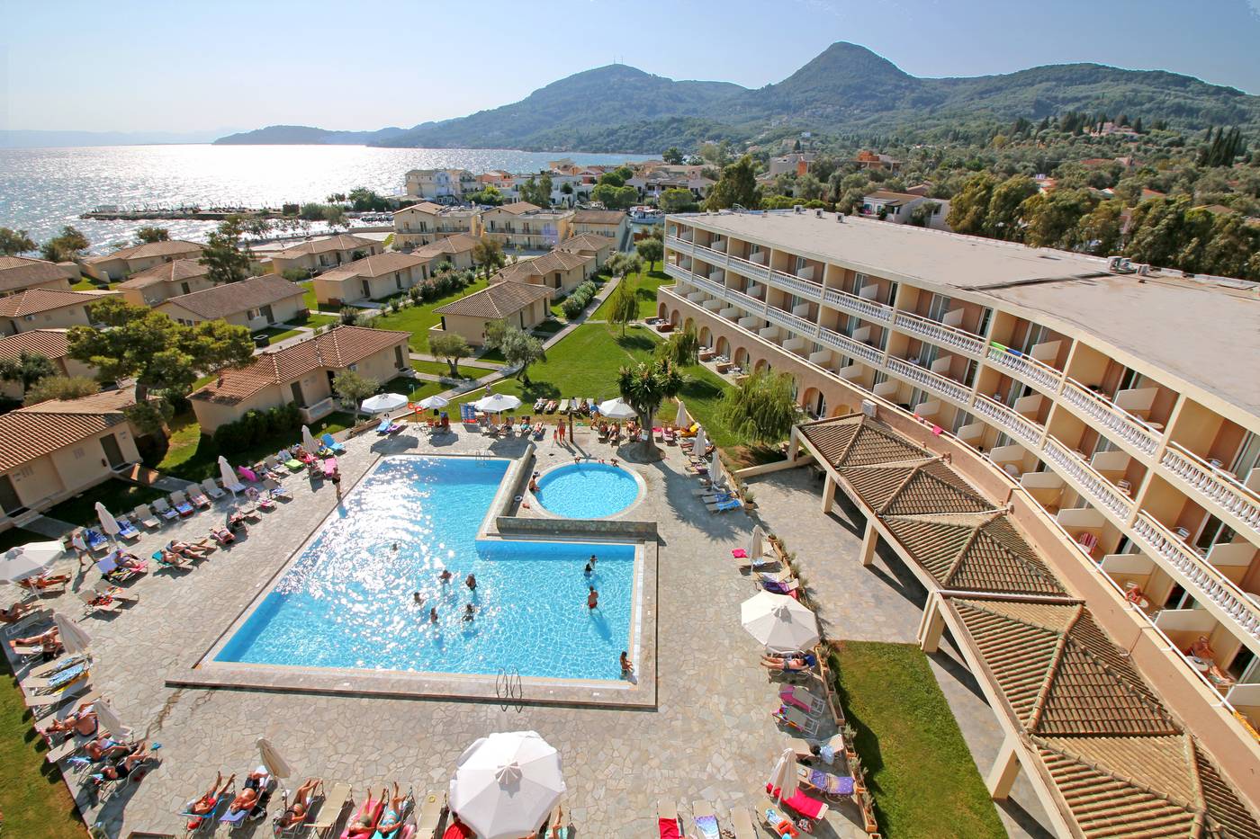 Overheard shot of hotel pool area with sun loungers