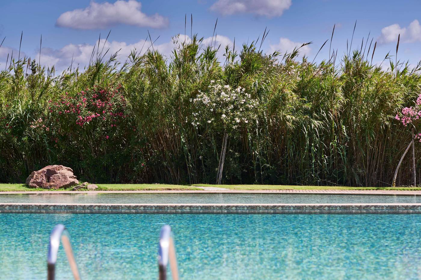 Baia-Chia-Laguna-Resort--Curio-Collection-By-Hilton-Pool-5