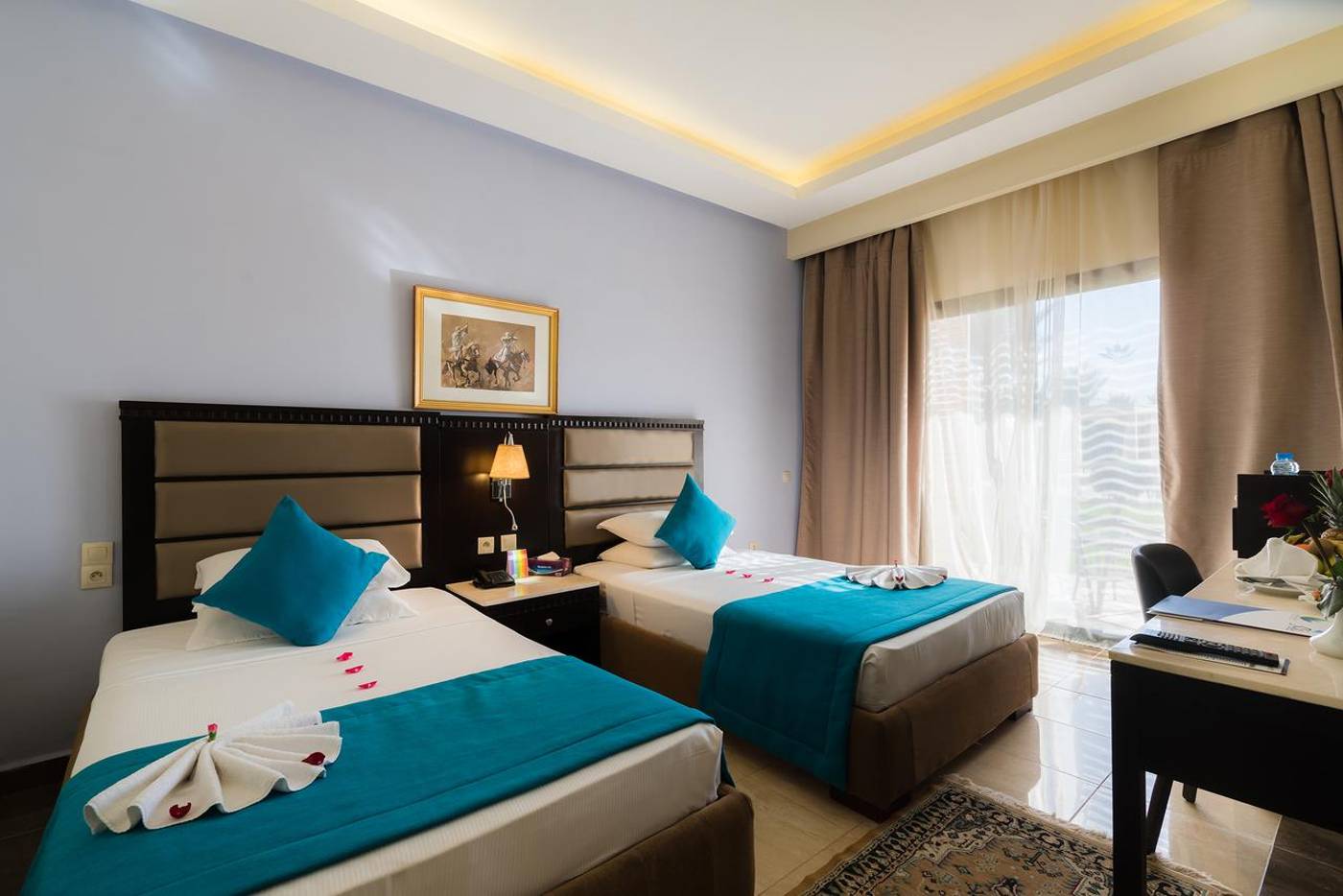 Room with twin beds and stylish decor Aqua Fun Club. 