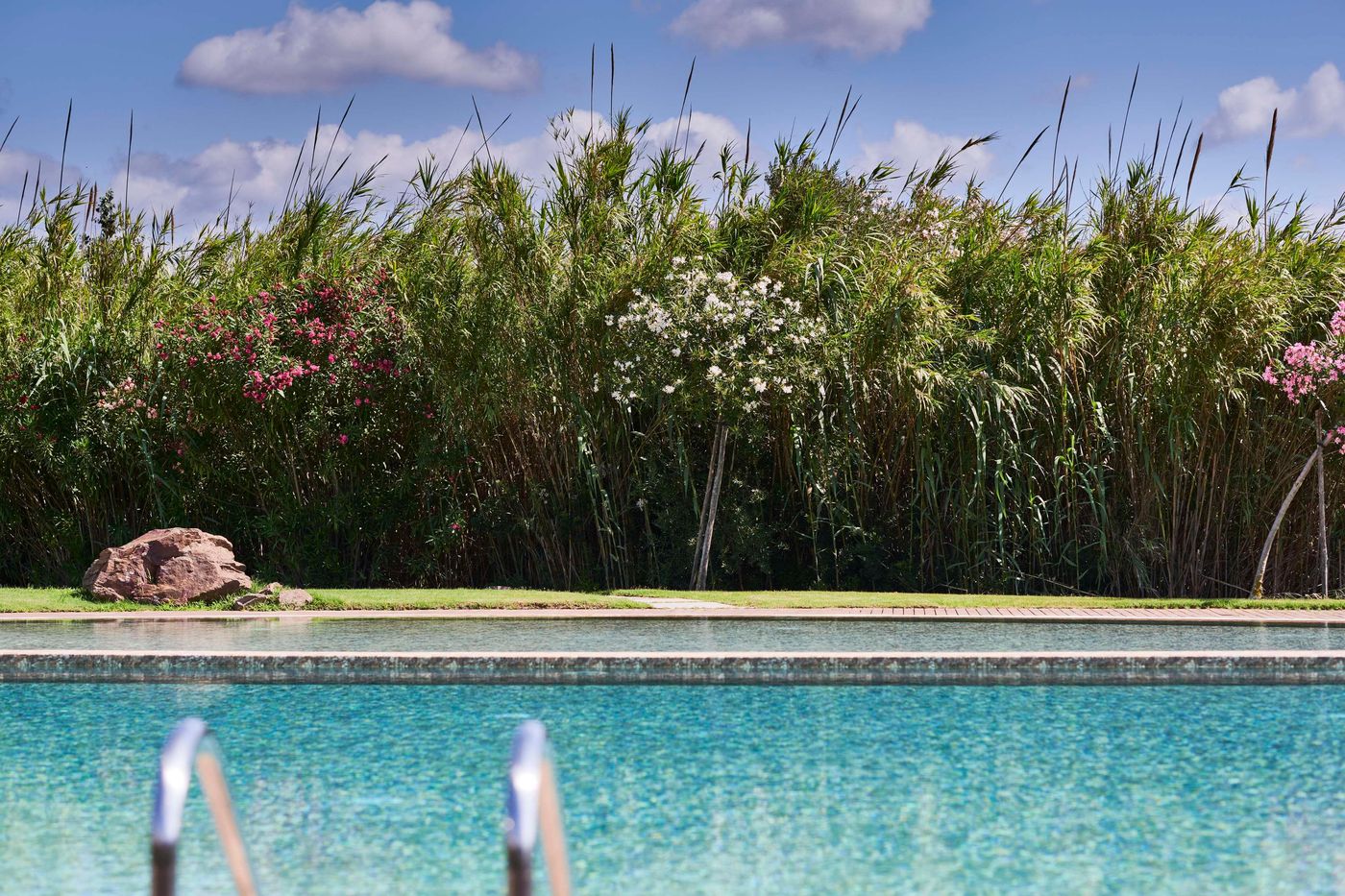 Baia-Chia-Laguna-Resort--Curio-Collection-By-Hilton-Pool-5