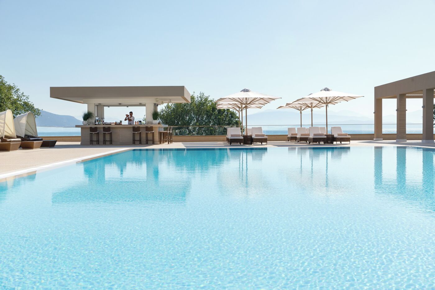 Ikos Dassia Hotel swimming pool with loungers